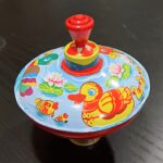 TROTTOLA IN LATTA E PLASTICA